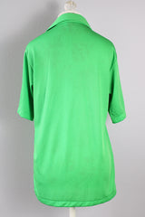 Women's or men's vintage 1970's Designed by David Harrison label short sleeve half button shirt with pointy collar in a bright vibrant green color.