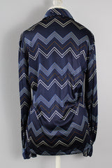 Women's or men's vintage 1970's Roland label long sleeve button up shirt with a pointy collar in navy slinky polyester with a zig zag print.