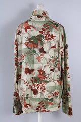 Men's or women's vintage 1970's Jean Joint label long sleeve button up shirt with a pointy collar in green with an all over brown floral and butterfly print.
