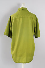 Men's or women's vintage 1970's Sears, The Men's Store label short sleeve button up shirt with a pointy collar and one chest pocket in vibrant olive green cotton polyester blend material