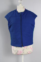 Women's vintage medium 1980's SKYR by Hertha Amen label sleeveless capped sleeved short length zip up bright blue Nylon ski vest with red and green stripes on the sides.