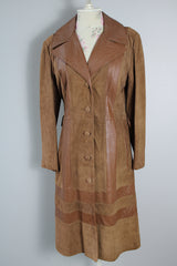 Women's vintage 1970's New England Sportswear Company label long length brown suede and leather trench coat that buttons up the front.