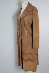 Women's vintage 1970's New England Sportswear Company label long length brown suede and leather trench coat that buttons up the front.