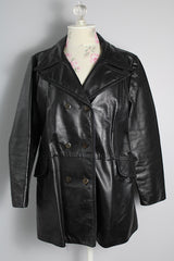 Women's vintage 1970's Adler Leather, Made in California label long sleeve black leather jacket with a double breasted closure