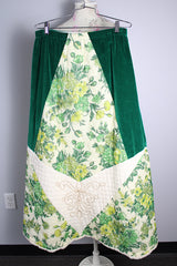 Women's vintage 1970's Chelsea Davis label a line shaped maxi skirt in a patchwork quilted print. Green velvet with white and green floral patches.
