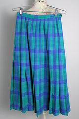 Women's vintage 1980's Miss Pendleton, Made in USA label midi length pleated wool plaid print skirt in blue, green, and pink colors.