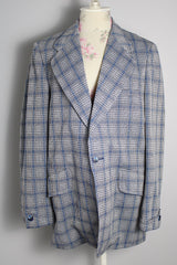 Men's vintage 1970's Montgomery Ward polyester double breasted blazer in a grey and blue plaid print.