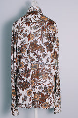 Men's vintage 1970's long sleeve button up shirt with a pointy collar in a lightweight Polyester material. White with all over brown floral print.