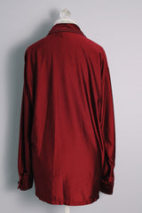 Men's vintage 1970's JCPenney Towncraft label long sleeve button up shirt with a pointy collar in maroon colored lightweight polyester material with white contrast stitching and a left chest pocket.