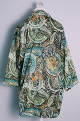 Women's or men's vintage 1970's Montgomery Ward label short sleeves on the long side, button up shirt with pointy collar in an all over abstract print in greens and yellows.