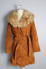 Women's vintage 1970's Leatherscapade, Made in Argentina label long sleeve brown orange genuine leather suede coat with faux fur trim and shearling liner with matching tie belt.