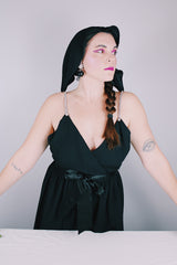 Women's vintage 1980's Morton Myles LTD., Union Made, Made in USA sleeveless rhinestone strap black midi length dress with V shaped neckline and ribbon tie belt.