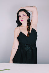 Women's vintage 1980's Morton Myles LTD., Union Made, Made in USA sleeveless rhinestone strap black midi length dress with V shaped neckline and ribbon tie belt.