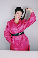 Women's vintage 1980's Windsor Bay long sleeve long length bright pink nylon and polyester button up windbreaker jacket.