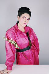 Women's vintage 1980's Windsor Bay long sleeve long length bright pink nylon and polyester button up windbreaker jacket.