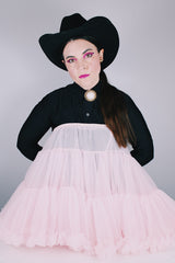 Women's vintage 1960's light pink sheer Nylon material crinoline skirt with stretchy elastic waistband. Double layered with ruffle trim hems.