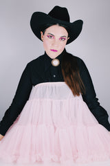 Women's vintage 1960's light pink sheer Nylon material crinoline skirt with stretchy elastic waistband. Double layered with ruffle trim hems.