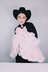 Women's vintage 1960's light pink sheer Nylon material crinoline skirt with stretchy elastic waistband. Double layered with ruffle trim hems.