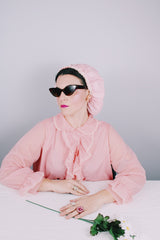 Women's vintage 1970's Hollywood Vassarette by Munsingwear, Made in USA label long sleeve ankle length baby pink nightgown in sheer nylon material.