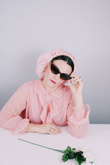 Women's vintage 1970's Hollywood Vassarette by Munsingwear, Made in USA label long sleeve ankle length baby pink nightgown in sheer nylon material.