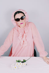 Women's vintage 1970's Hollywood Vassarette by Munsingwear, Made in USA label long sleeve ankle length baby pink nightgown in sheer nylon material.