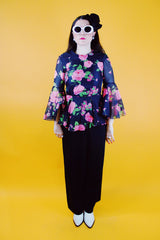 dress with pink floral top half and black bottom bell sleeves and floor length vintage 1970's