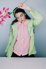 Women's vintage 1960's Saks Alley long sleeve two button closure double lapel blazer in light green and linen material.