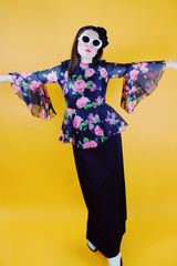 dress with pink floral top half and black bottom bell sleeves and floor length vintage 1970's
