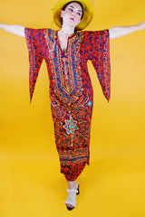 red ankle length tunic dress with embroidery and pointy bell sleeves