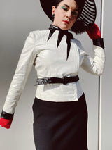 long sleeve white leather 1980's wilsons jacket with black trim and black belt asymmetrical zipper women's vintage