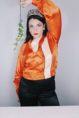 Women's or men's vintage 1940's/1950's long sleeve equestrian racing top in orange satin with one cream vertical stripe.