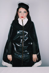 Women's vintage 1960's Aqua-Sheen by Exylin Co., Made in USA label vinyl material poncho with shiny exterior in black and white.