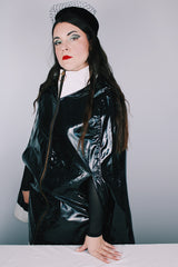 Women's vintage 1960's Aqua-Sheen by Exylin Co., Made in USA label vinyl material poncho with shiny exterior in black and white.