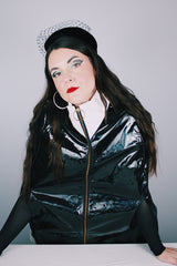 Women's vintage 1960's Aqua-Sheen by Exylin Co., Made in USA label vinyl material poncho with shiny exterior in black and white.