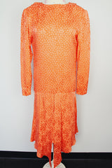 long sleeve orange silk dress with polka dot print and asymmetrical hem vintage 1980's