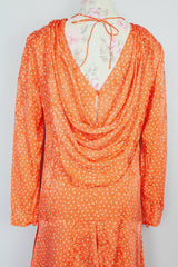long sleeve orange silk dress with polka dot print and asymmetrical hem vintage 1980's