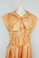 short sleeve midi length orange and pink paisley print a line dress vintage 1950's