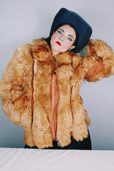 Women's vintage 1970's Designer Originals, Dino Ricco label long sleeve zip up tan brown faux fur jacket with rounded collar and side pockets.