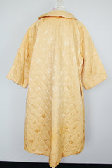 gold colored quilted duster jacket buttons up the front with collar and moon and star all over print