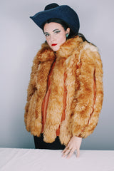 Women's vintage 1970's Designer Originals, Dino Ricco label long sleeve zip up tan brown faux fur jacket with rounded collar and side pockets.