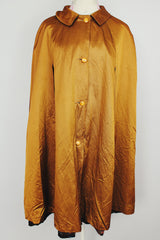 1960's reversible poncho with buttons and collar one side is gold one side is floral print vintage