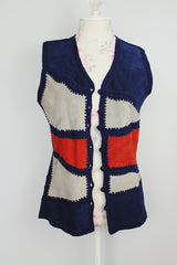 navy knit button up vest with grey and brown suede panels in the front vintage 1970's