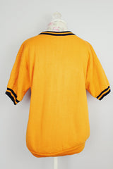 short sleeve orange pullover crew neck with navy striped trim around cuffs and neck vintage 1970's