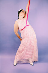 sleeveless pink dress with polka dot sheer lace overlay and ribbon around waist vintage 1960's