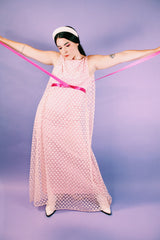 sleeveless pink dress with polka dot sheer lace overlay and ribbon around waist vintage 1960's