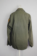 long sleeve green army jacket buttons up with two chest pockets vintage