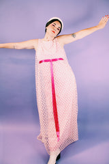 sleeveless pink dress with polka dot sheer lace overlay and ribbon around waist vintage 1960's