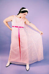 sleeveless pink dress with polka dot sheer lace overlay and ribbon around waist vintage 1960's