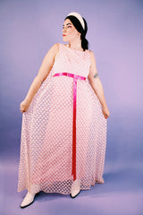 sleeveless pink dress with polka dot sheer lace overlay and ribbon around waist vintage 1960's