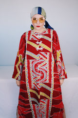 Women's vintage 1970's long sleeve printed cotton muu muu dress in red, green, grey, and white.